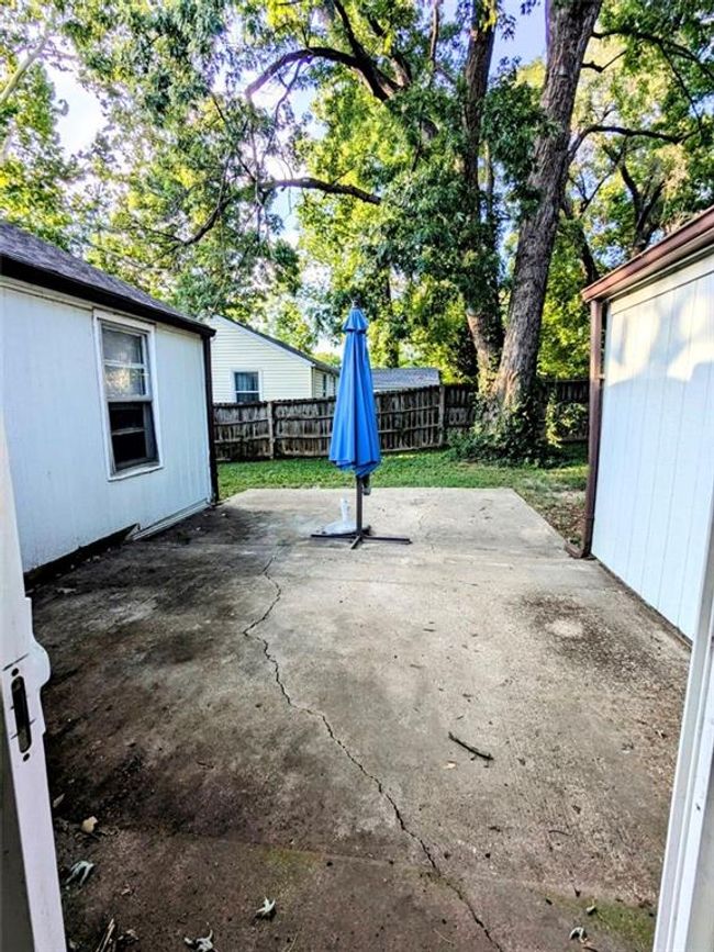 Fenced backyard featuring a patio | Image 16