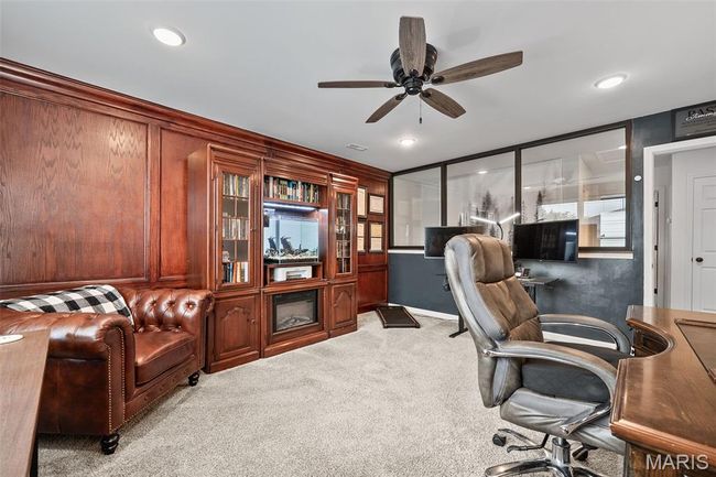 Office space with carpet floors and ceiling fan | Image 39