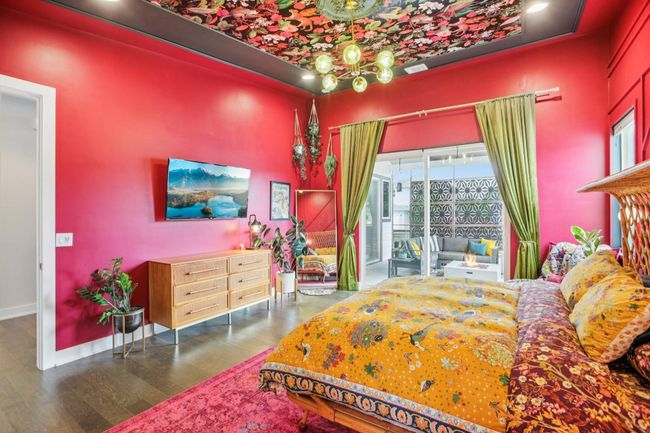 Bedroom featuring wood finished floors and a chandelier | Image 20