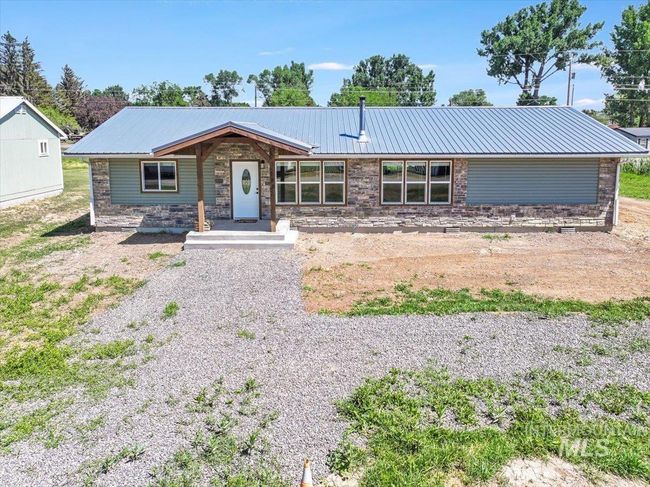 View of front facade with a metal roof and stone siding | Image 43