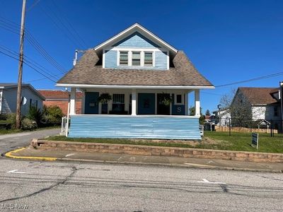 Bungalow-style home with a porch | Image 1