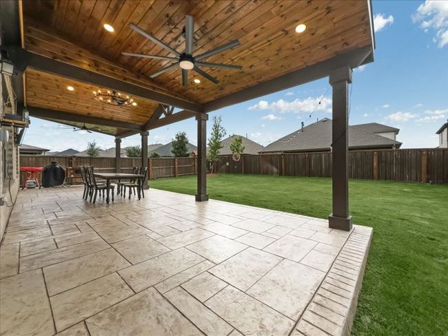 View of patio featuring a ceiling fan | Image 26