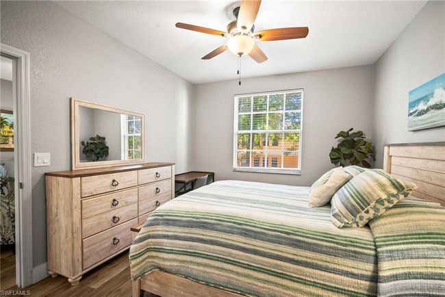 Bedroom featuring dark wood-style floors and a ceiling fan | Image 17