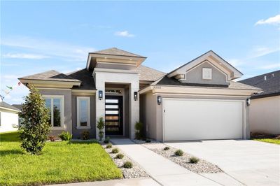 Prairie-style home with a garage and a front lawn | Image 3