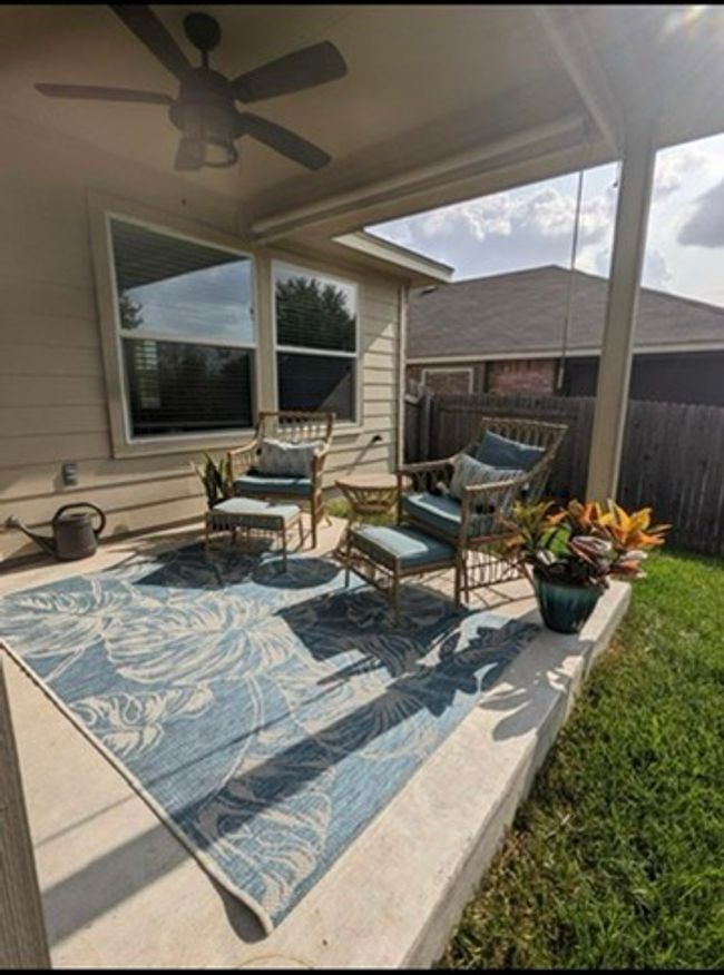View of patio featuring a ceiling fan. Large green space backing up to no neighbors. | Image 17