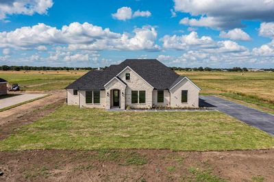 View of front of house featuring a front lawn and a rural view | Image 1