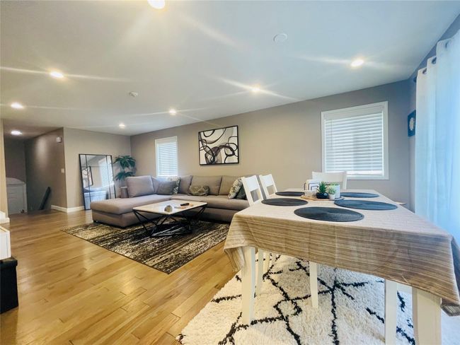 Living area wood finished floors, and recessed lighting | Image 11
