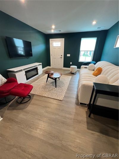 Living room with hardwood / wood-style flooring | Image 2