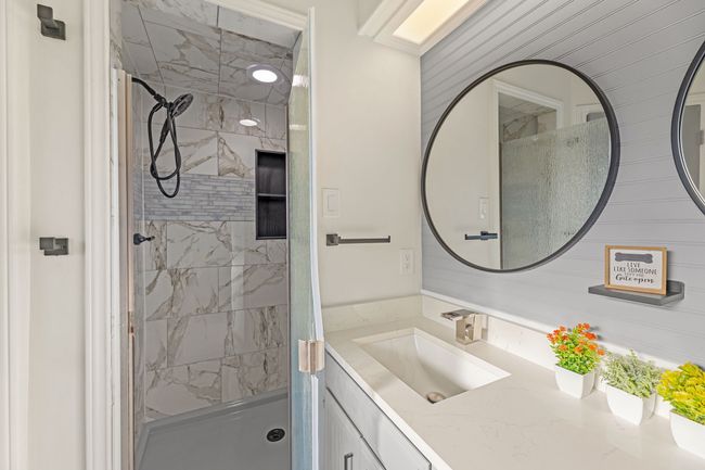 Bathroom with a stall shower and vanity | Image 33