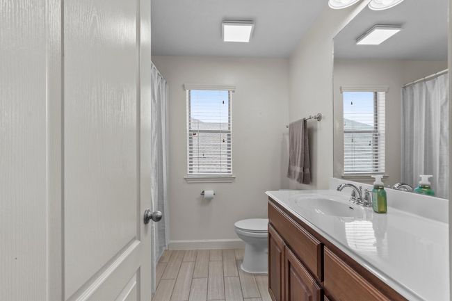 This bedroom pulls double duty—ideal for sleep, study, or gaming with room to spare. | Image 30