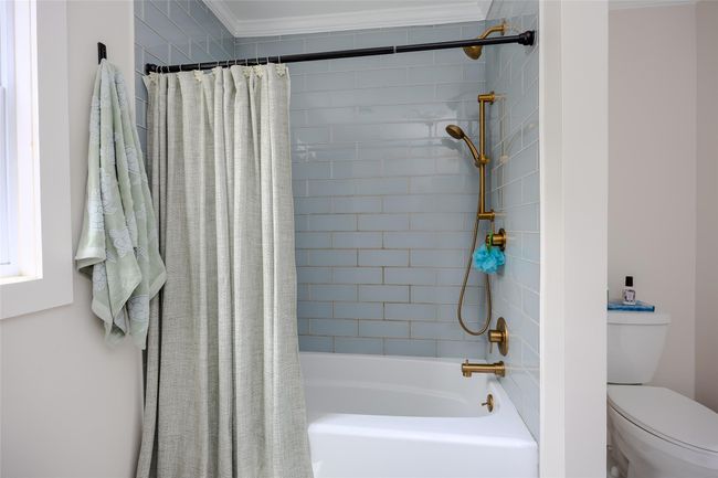 Bathroom with shower / tub combo with curtain and crown molding | Image 28