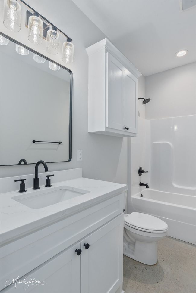 Full bath with vanity, recessed lighting, tub / shower combination, and toilet | Image 15