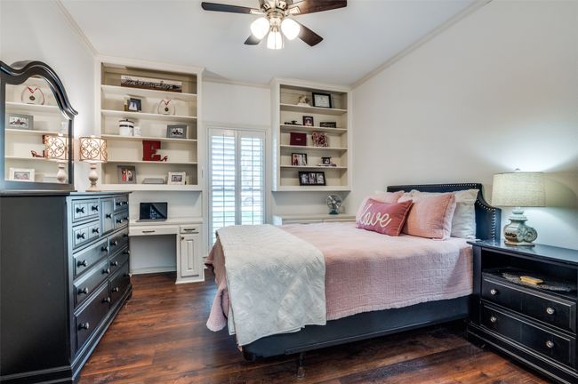 ceiling fan, build in bookcases, crown molding, walk in closet | Image 21