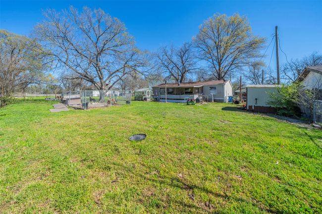 View of yard featuring a garden and fence | Image 18