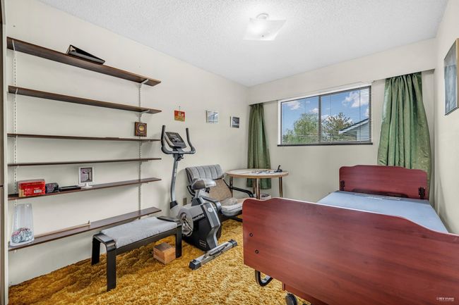 Bedroom featuring carpet flooring and a textured ceiling | Image 16