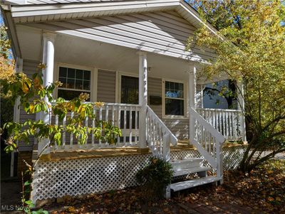 Doorway to property with a porch | Image 2