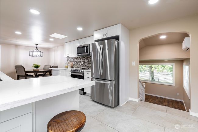 Kitchen bar to eat at on main level | Image 9