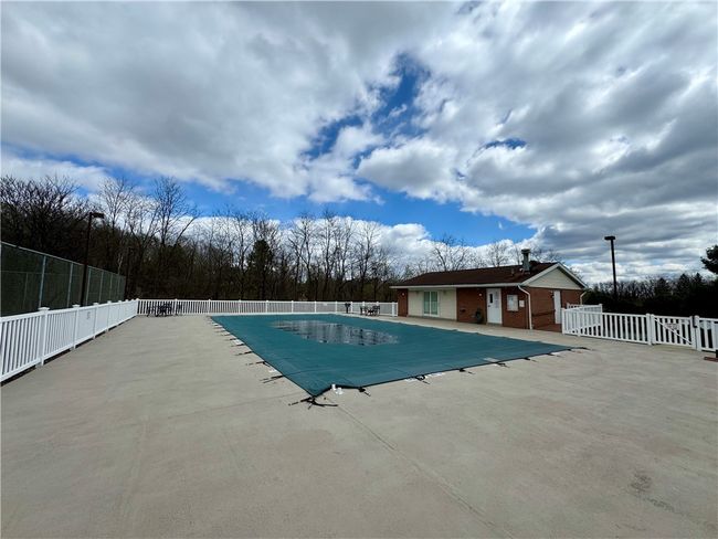 Community pool and clubhouse. | Image 34