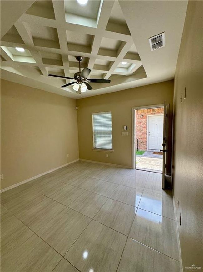 Additional view of tiled living room. | Image 4