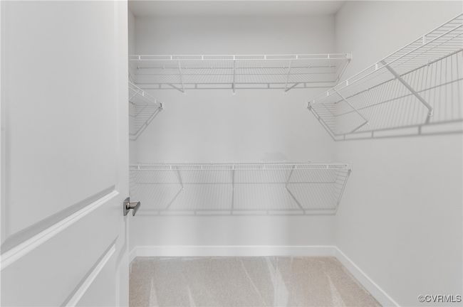 Spacious closet with carpet floors | Image 27