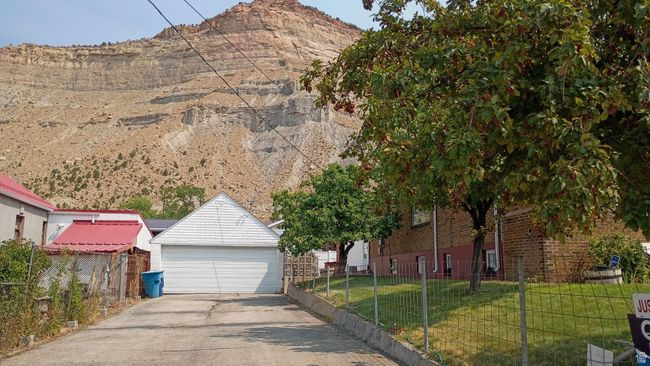 View of front of property with a garage, a mountain view, and brick siding | Image 5