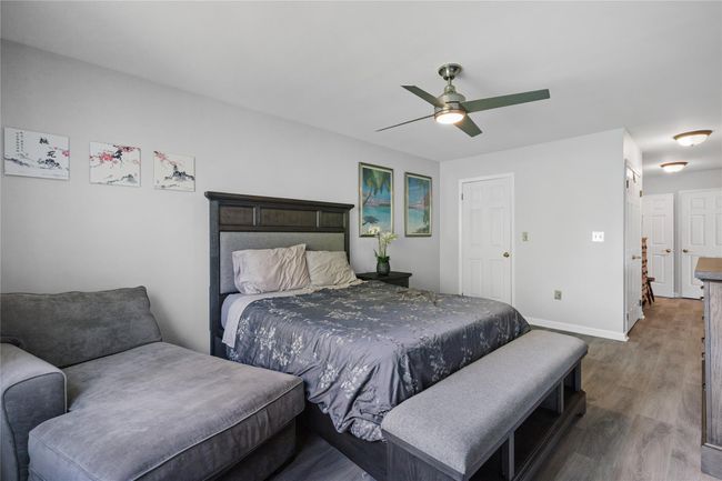 Bedroom featuring wood finished floors and a ceiling fan | Image 31