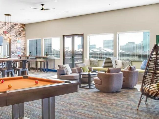 Rec room with ceiling fan, carpet floors, french doors, and billiards | Image 14