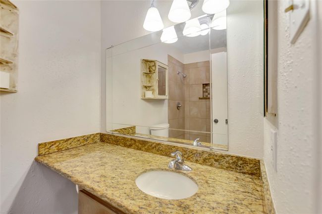 Primary bathroom with granite counters | Image 9