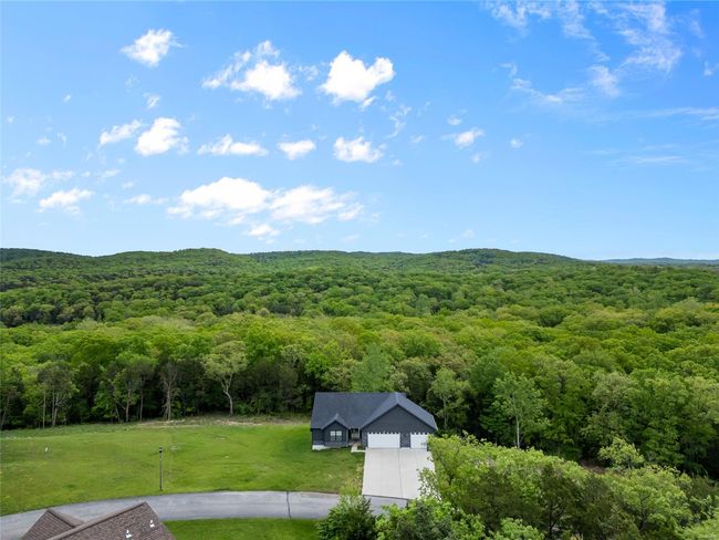Property view of mountains with a wooded view | Image 7