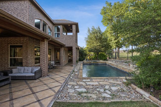 Outdoor pool featuring an in-ground hot tub, a patio area, a fenced backyard, and outdoor lounge area | Image 26