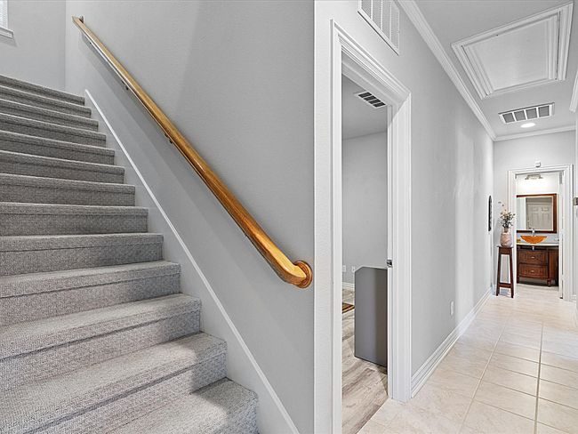 Stairs featuring attic access, crown molding, and tile patterned floors | Image 20