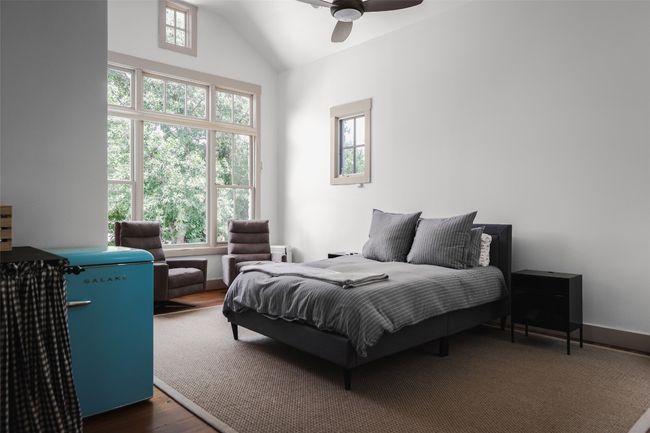 ADU bedroom area- high ceilings and pretty views of trees. | Image 24