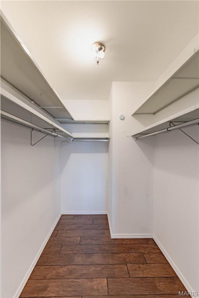Walk in closet with wood-type flooring | Image 43