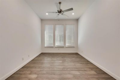 Unfurnished room with light wood-type flooring and ceiling fan | Image 3