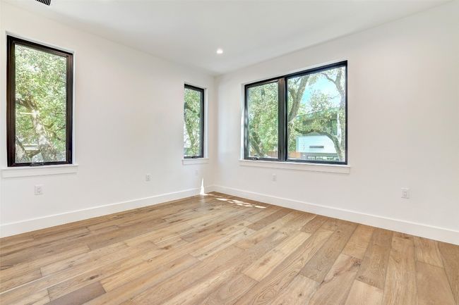 Empty room featuring light wood finished floors, baseboards, and recessed lighting | Image 28
