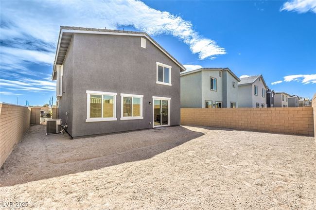 Rear view of property featuring cooling unit, Pictures of are a model home and are or representational purposes only. | Image 19
