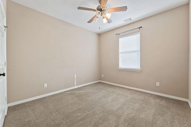 3rd bedroom with ceiling fan | Image 30