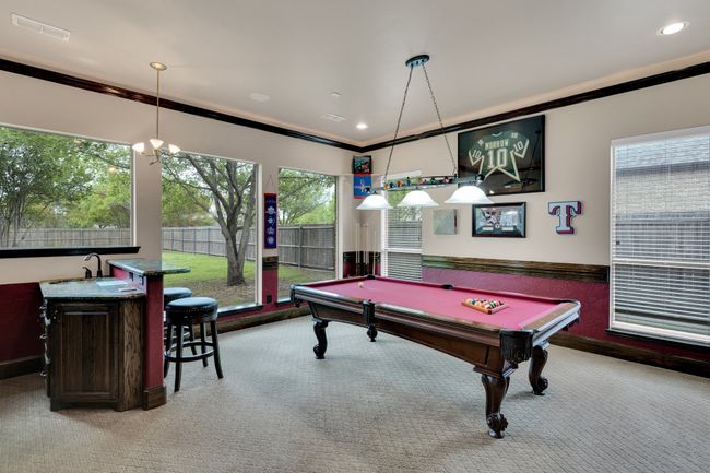 Game room with pool table and bar | Image 36
