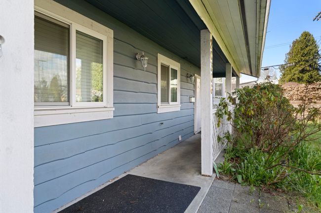 View of property exterior with a porch | Image 5