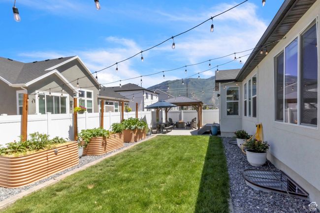 Fenced yard with a patio and a residential view | Image 30