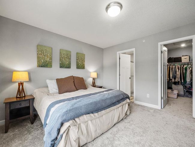 The primary bedroom with a 10' x 5' walk-in closet and private bath. | Image 15