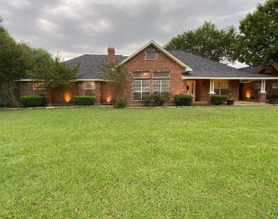 View of front of home featuring a front yard | Image 1