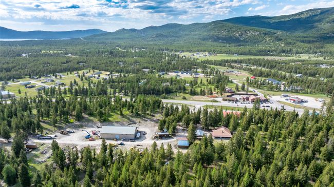 Aerial view of mountains and a heavily wooded area | Image 86