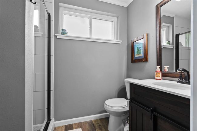 Primary Bathroom with updated vanity, and a glass-enclosed shower. | Image 22