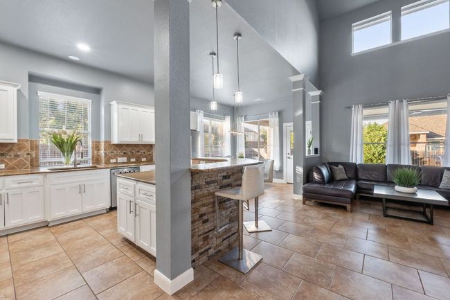 Light and bright living and kitchen area. | Image 9