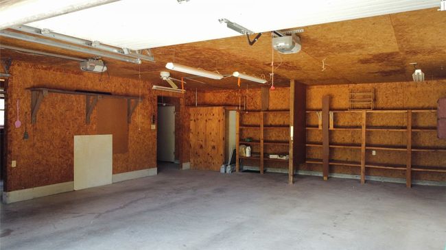 The workshop with additional storage and a bathroom. | Image 32