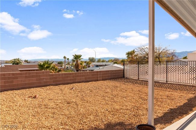 View of yard featuring a fenced backyard and a mountain view | Image 44