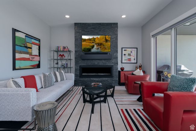 Living room with a fireplace, recessed lighting, and light wood-style floors | Image 8