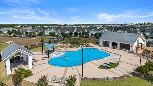 Community pool with a residential view and a patio | Image 36