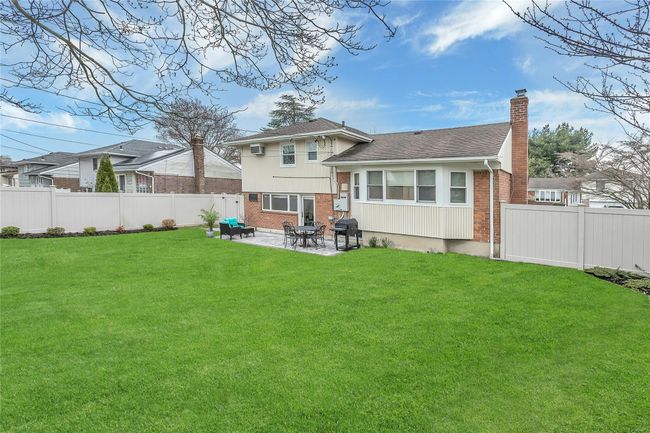Back of house with brick siding, a patio area | Image 28